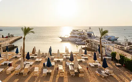 Sunset view over beach loungers